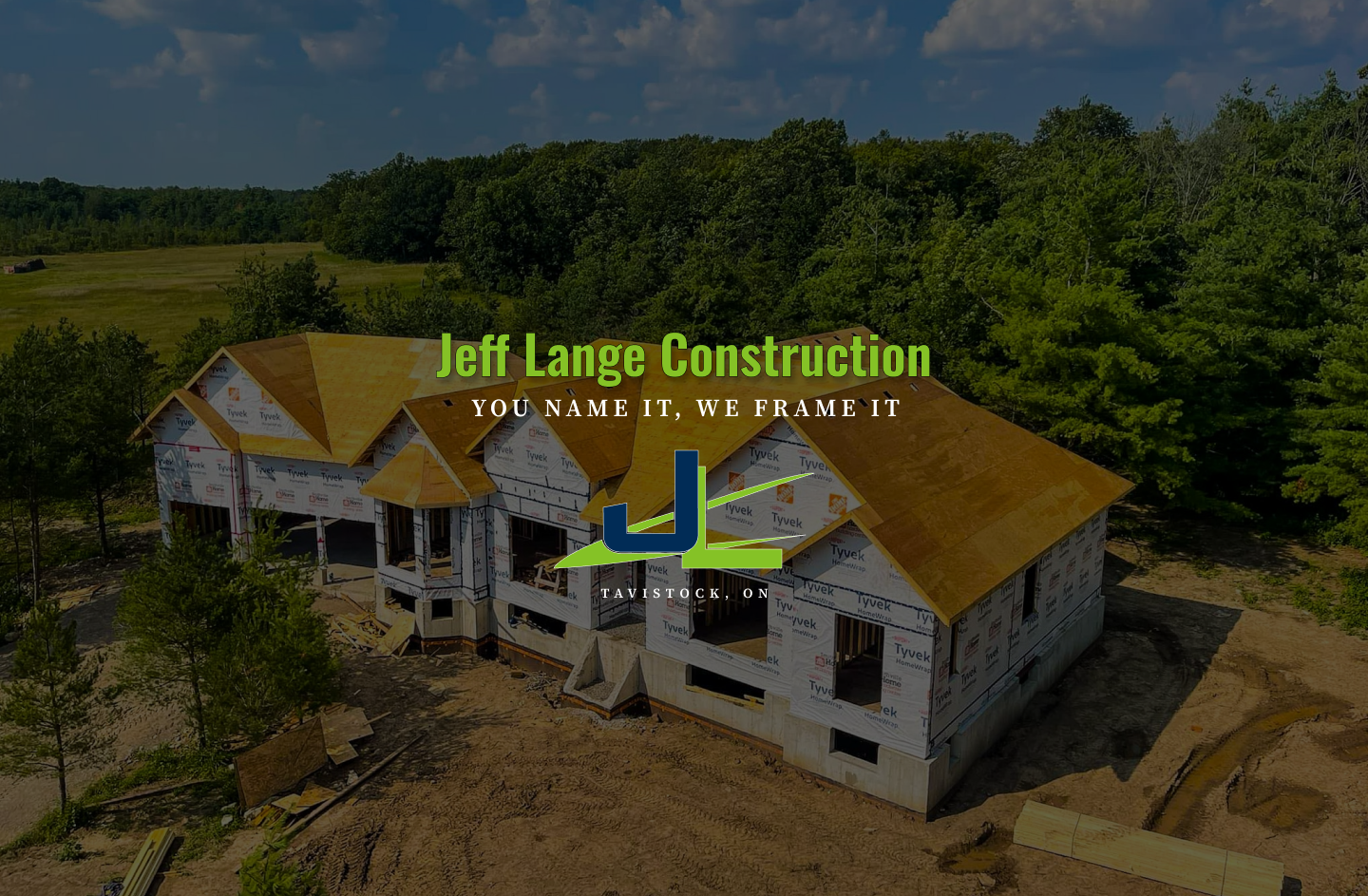 consruction equipment in front of a house being built, there are transparent green & blue bars over the image 